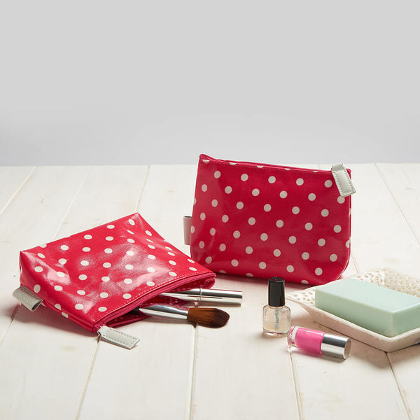detail of make-up bag in red polka dot print