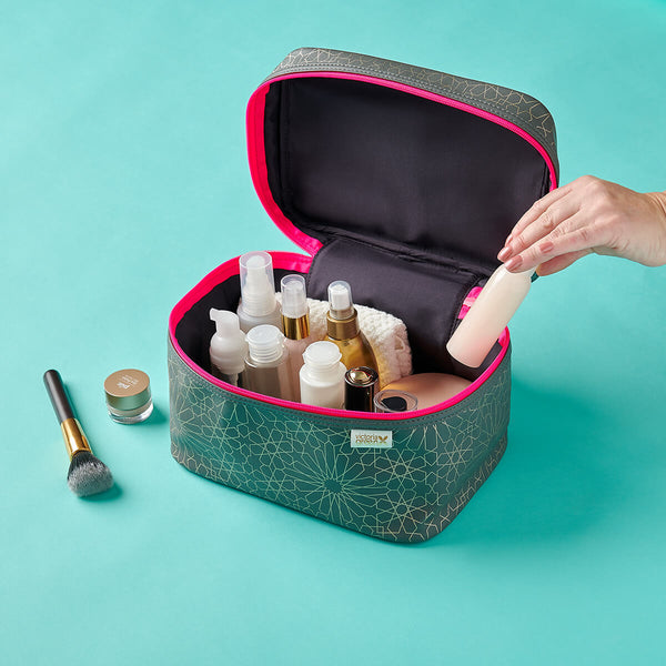 vanity case in mandala charcoal print with hand removing bottle