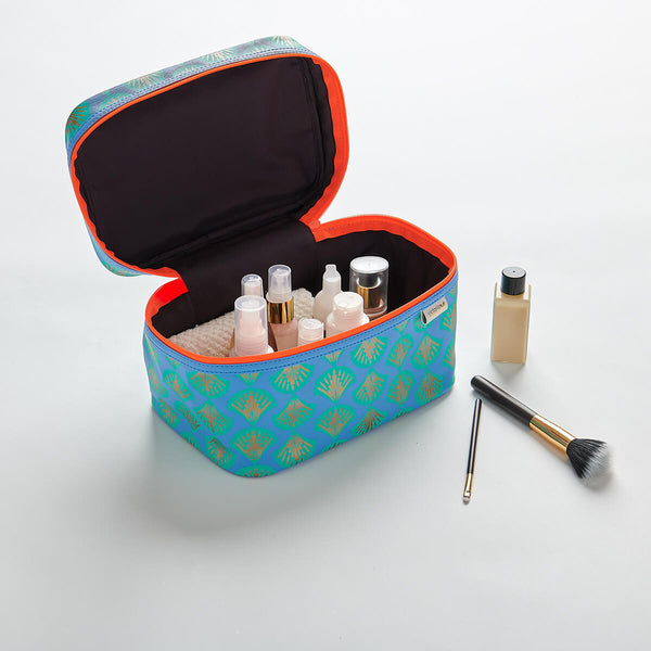 vanity case interior with toiletries in shell blue