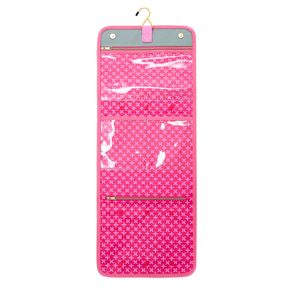 Inside of hanging wash bag in green colour with pink lining