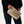 holding large makeup bag in gold