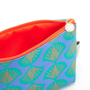small make up bag in Shell blue print interior with bright orange lining