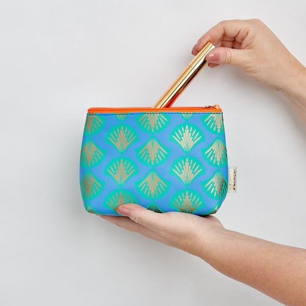 shell print small makeup bag open with product