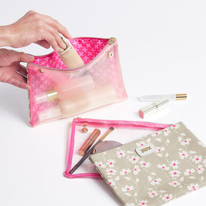 Toiletries being packed in 3 piece cosmetic bag